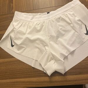 NIKE white running shorts 
Never worn with tags